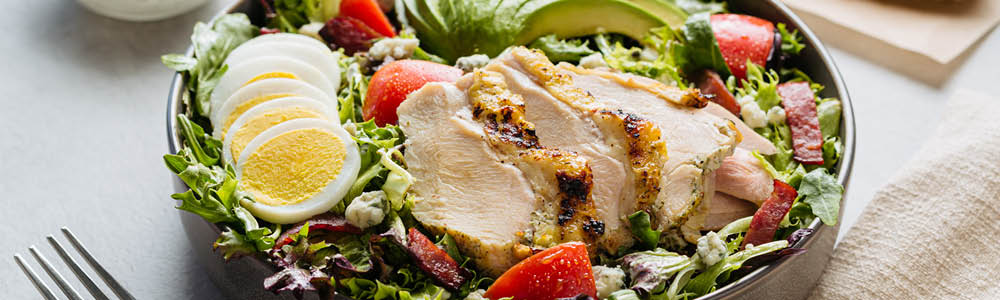 Chicken cobb salad with vegetables and dressing