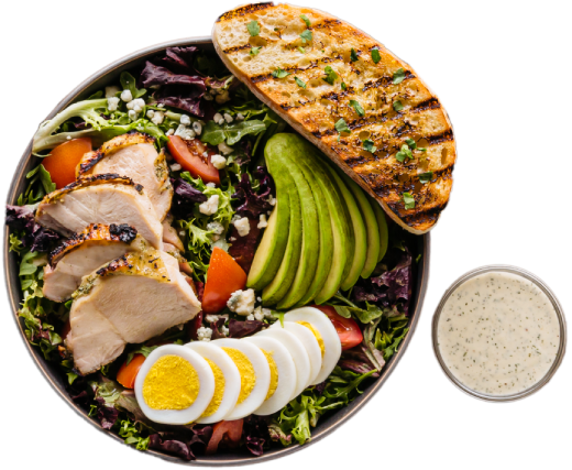 Grilled chicken plate with fresh vegetables and sides