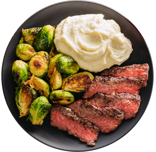 Grilled steak plate with sides