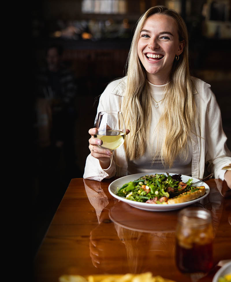 Woman enjoying Urban Plates meal